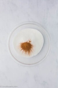 Cinnamon and sugar in mixing bowl.