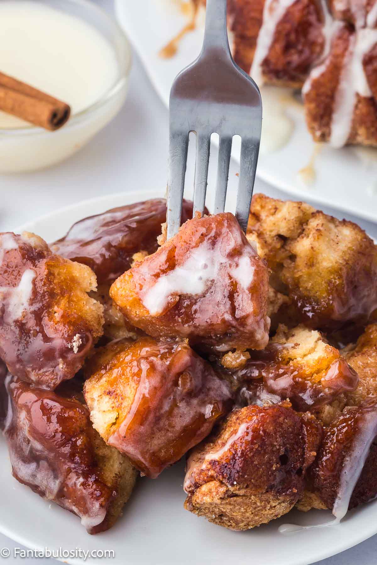 Fork sticking in to cinnamon sugar monkey bread.