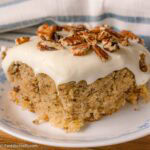 A serving of hummingbird cake on a vintage, round dessert plate.