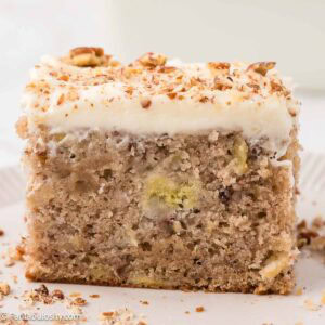 Slice of hummingbird sheet cake on plate.