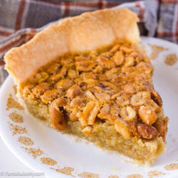 A slice of peanut pie on small Corelle Gold Butterfly plate.