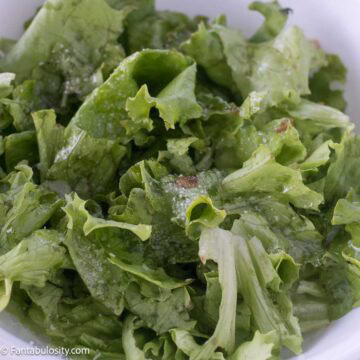 A bowl of wilted lettuce, that's leaf lettuce with bacon grease and salt.