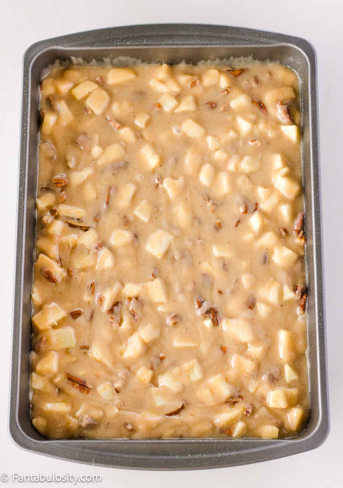 Unbaked harvest cake in 9x13 baking pan.