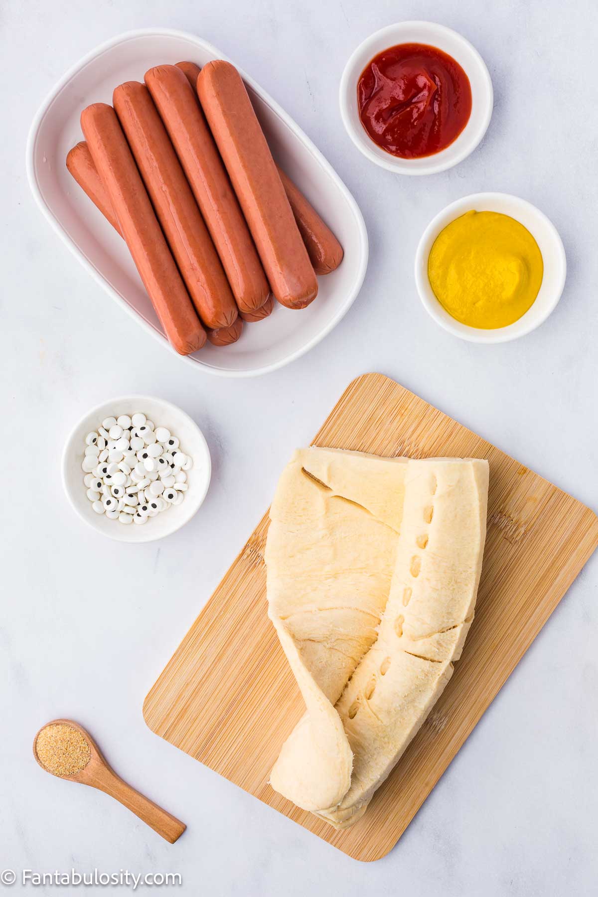 Ingredients on counter for making mummy hot dogs.
