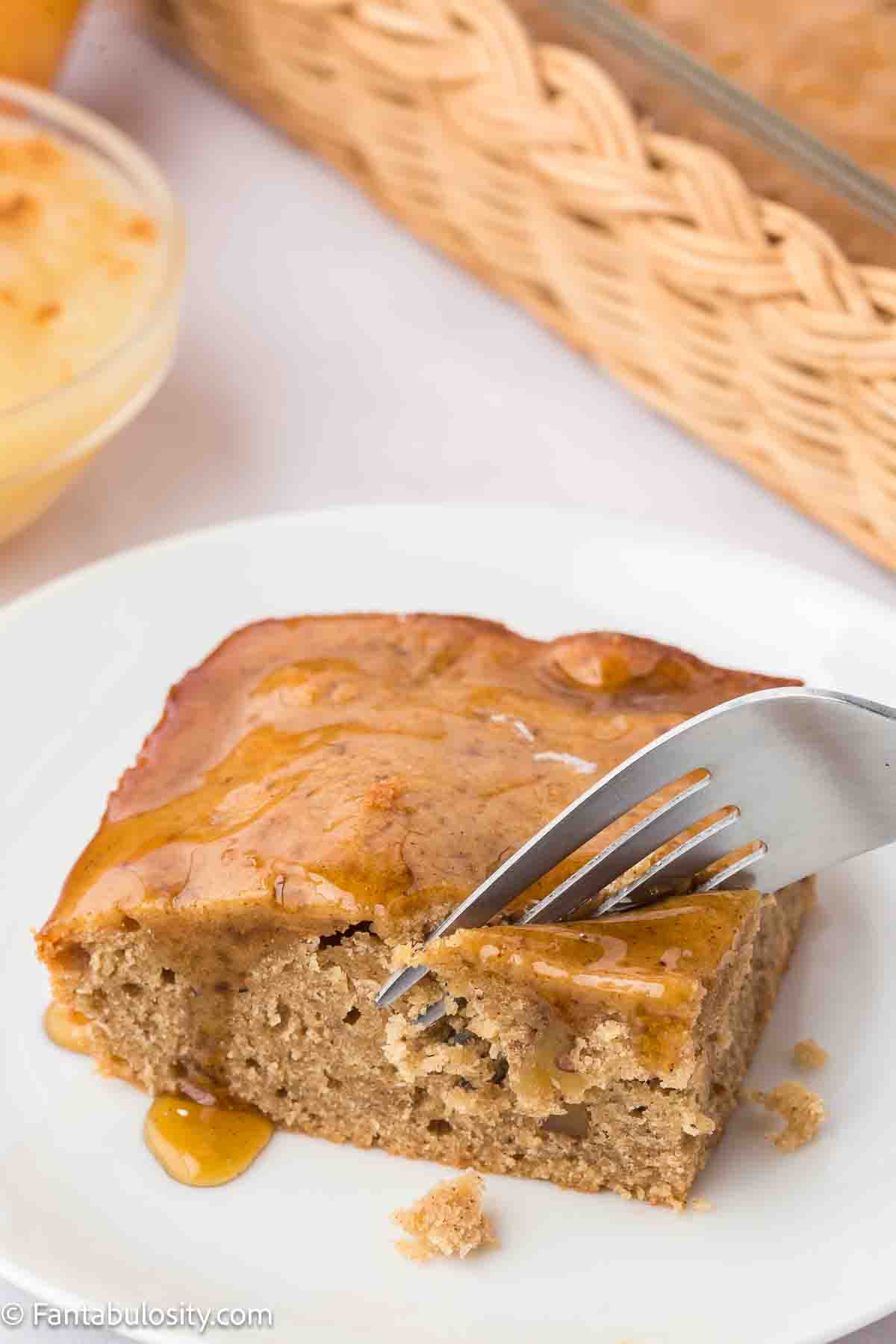 Cheesecake slice with caramel topping on white plate, dessert recipe, sweet treats, baked goods, delicious cheesecake.