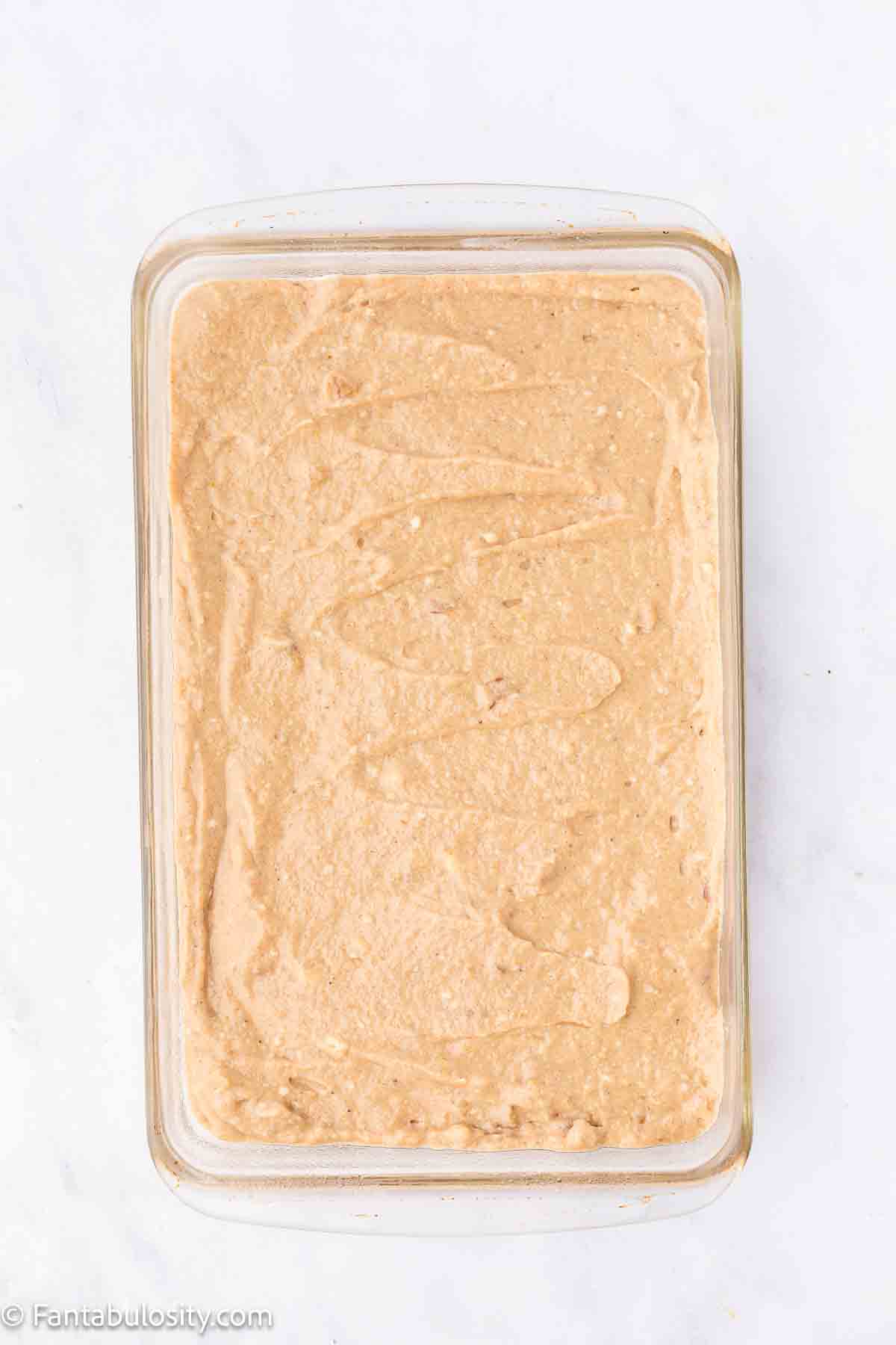 Unbaked amish applesauce cake in 9x13 baking dish.