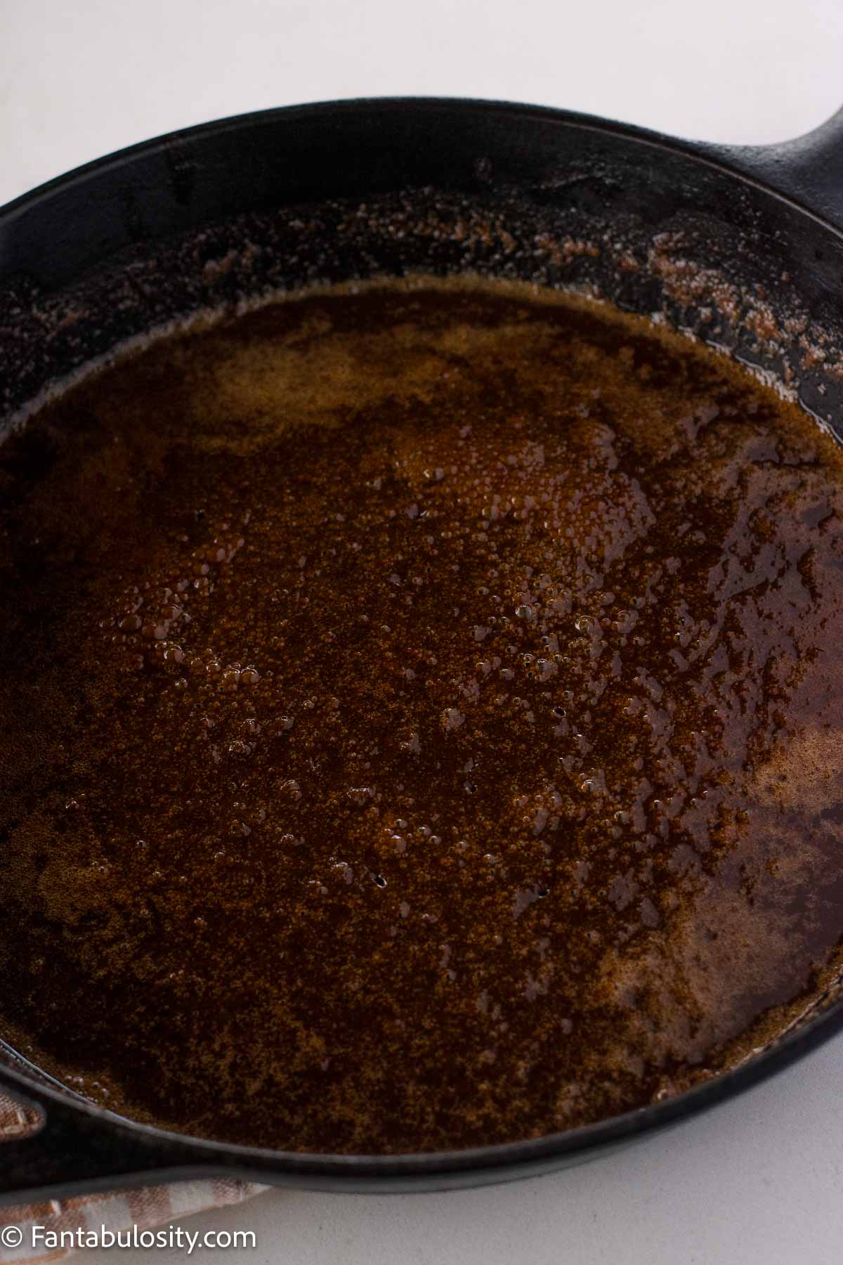 Butter, brown sugar and cinnamon in cast iron skillet.