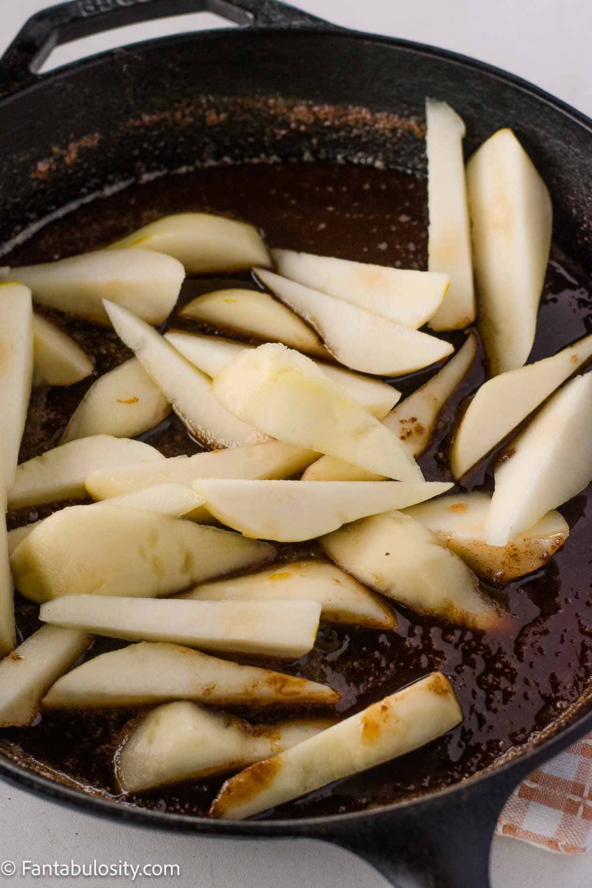 Pears added to butter and sugar mixture.