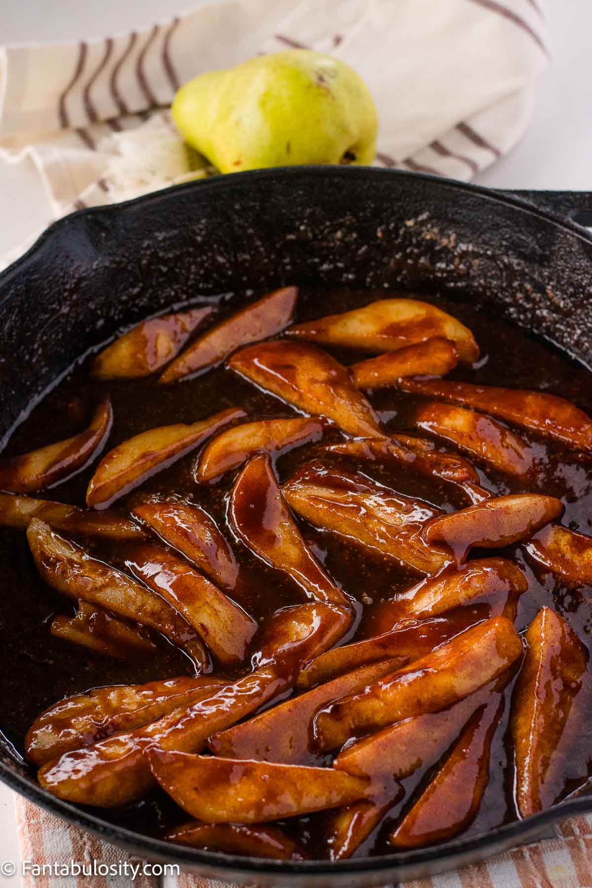 Fried pears in cast iron skillet.
