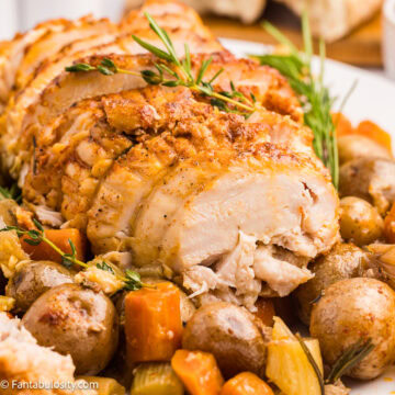Crock Pot Boneless Turkey Breast on plate with vegetables.