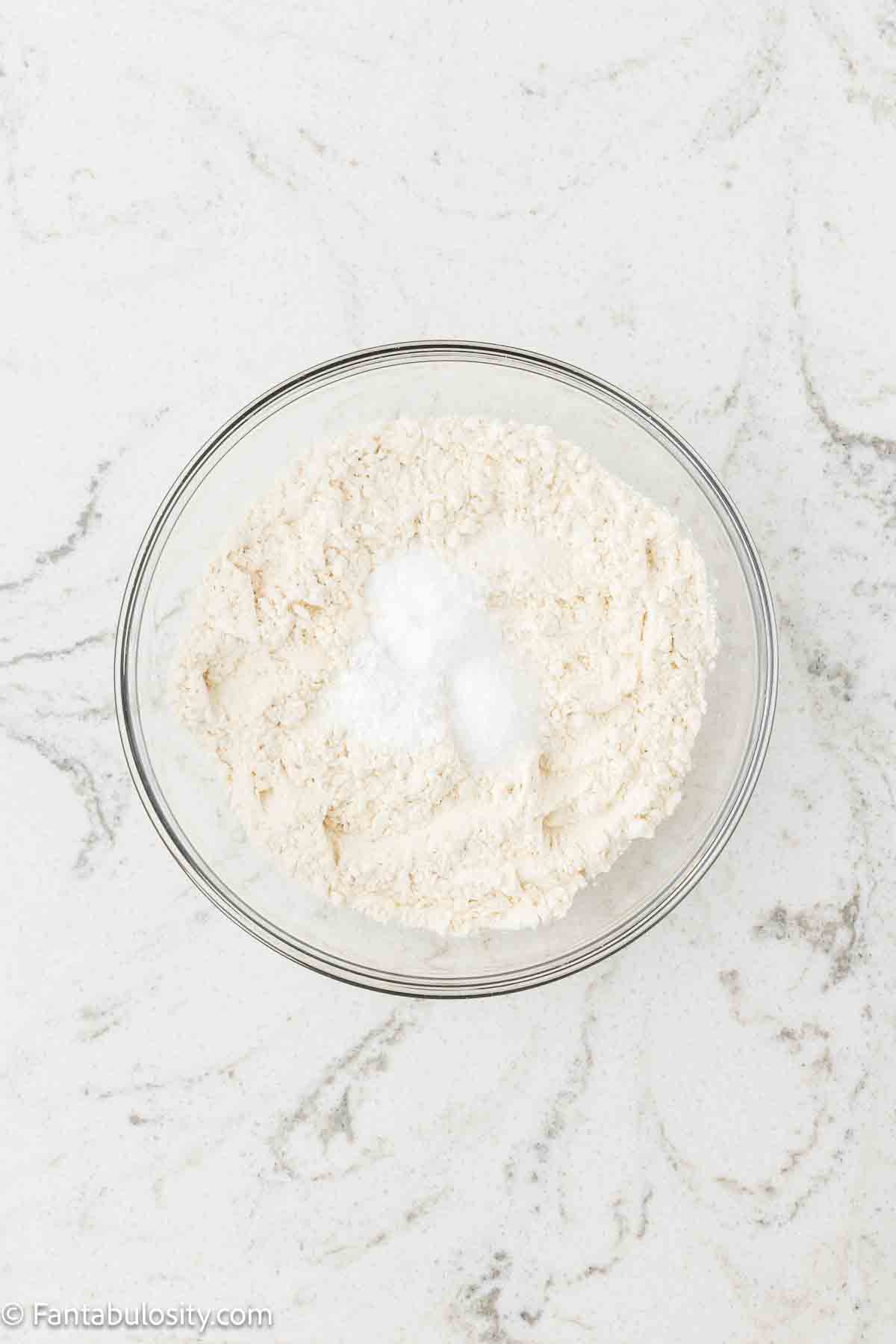 Dry ingredients for German chocolate sheet cake in mixing bowl.