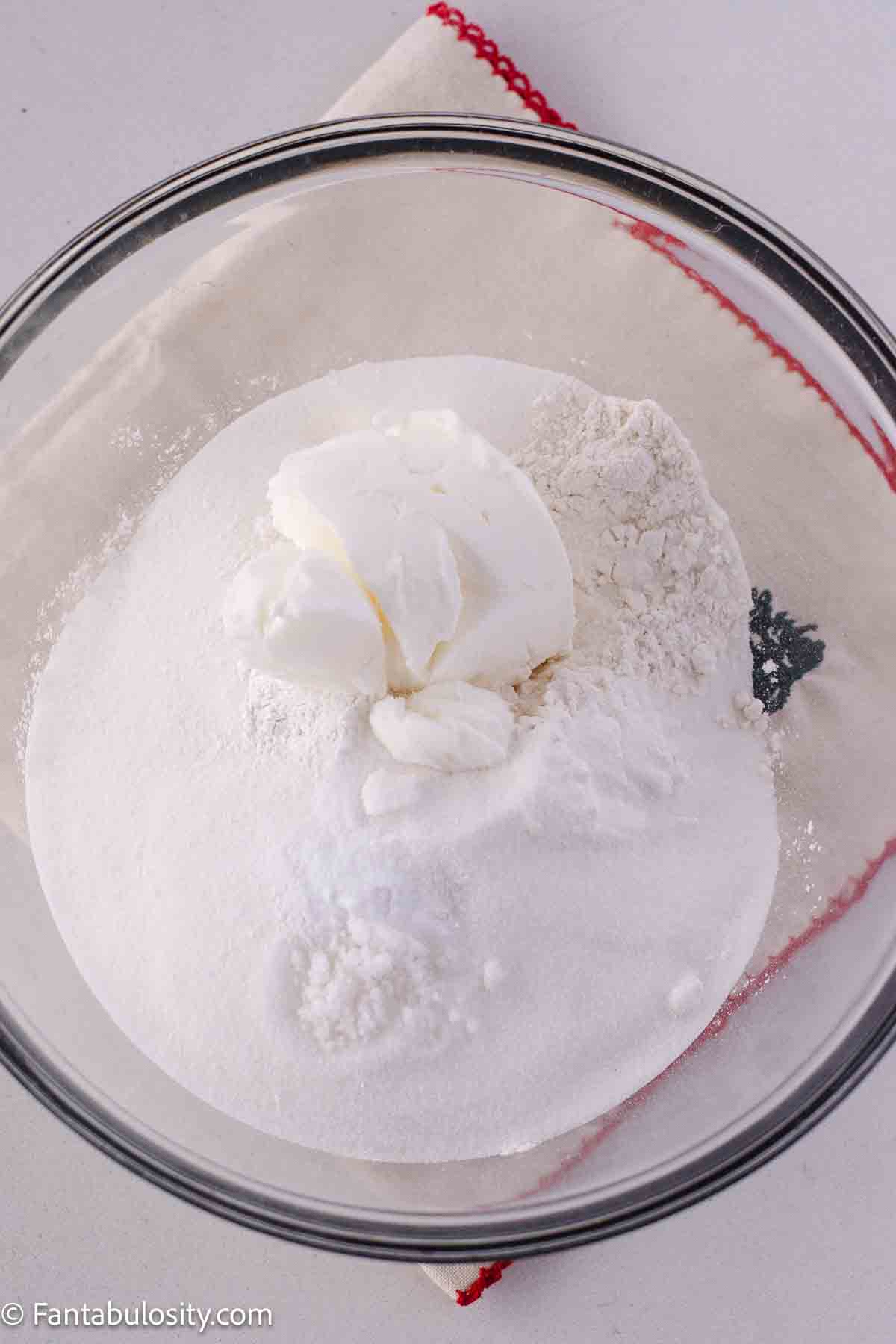 Flour, salt, baking powder and soda and shortening in mixing bowl.