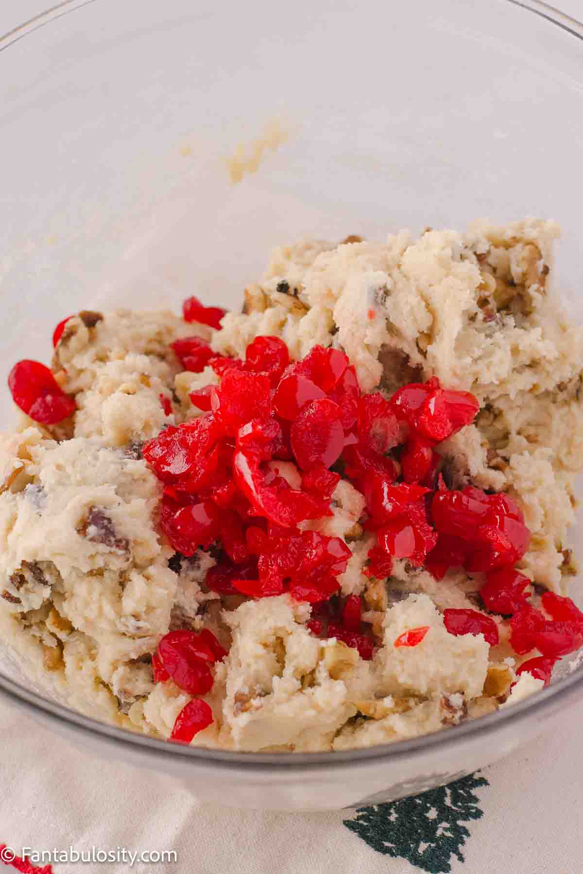 Chopped, drained cherries in cookie dough.