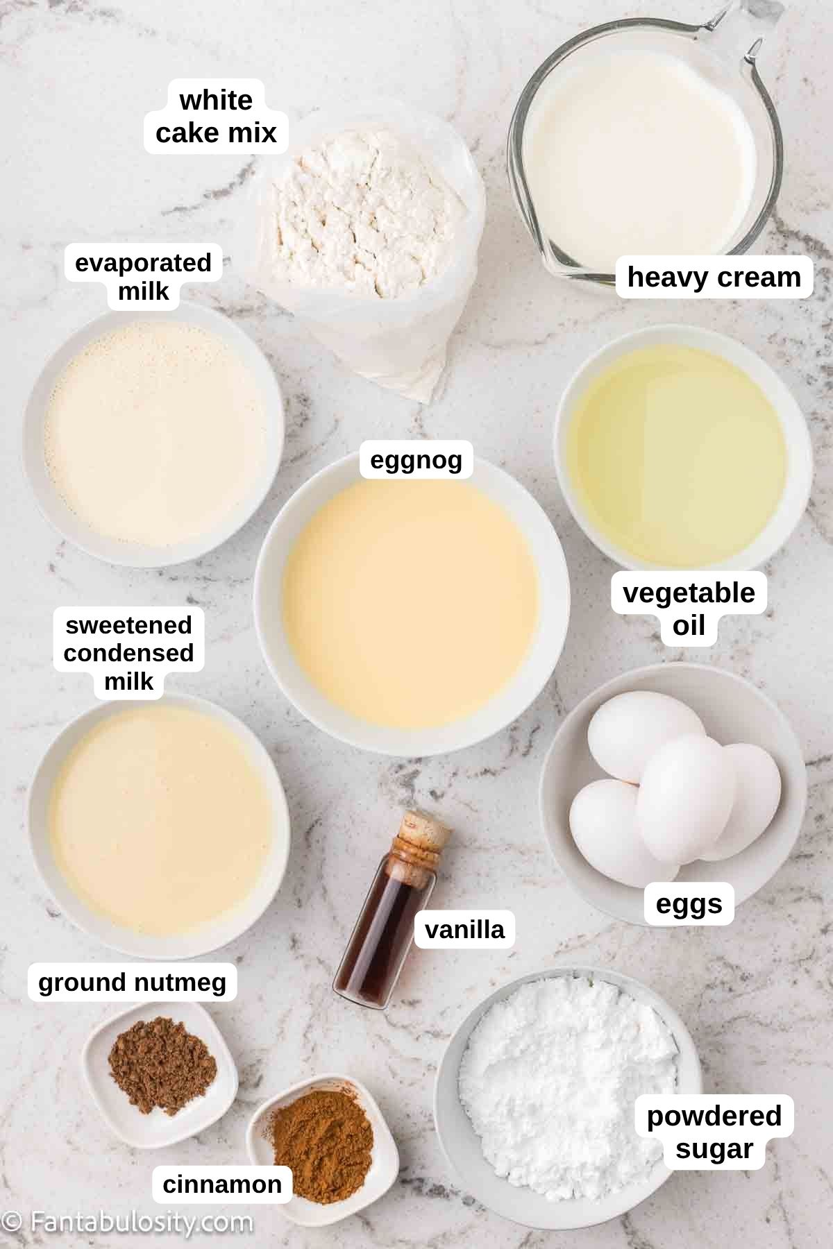 Labeled ingredients on counter for eggnog tres leches cake.