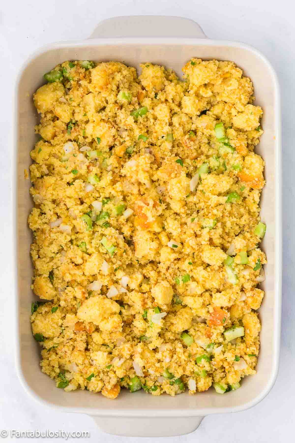 Cornbread dressing in a 9x13 baking dish.