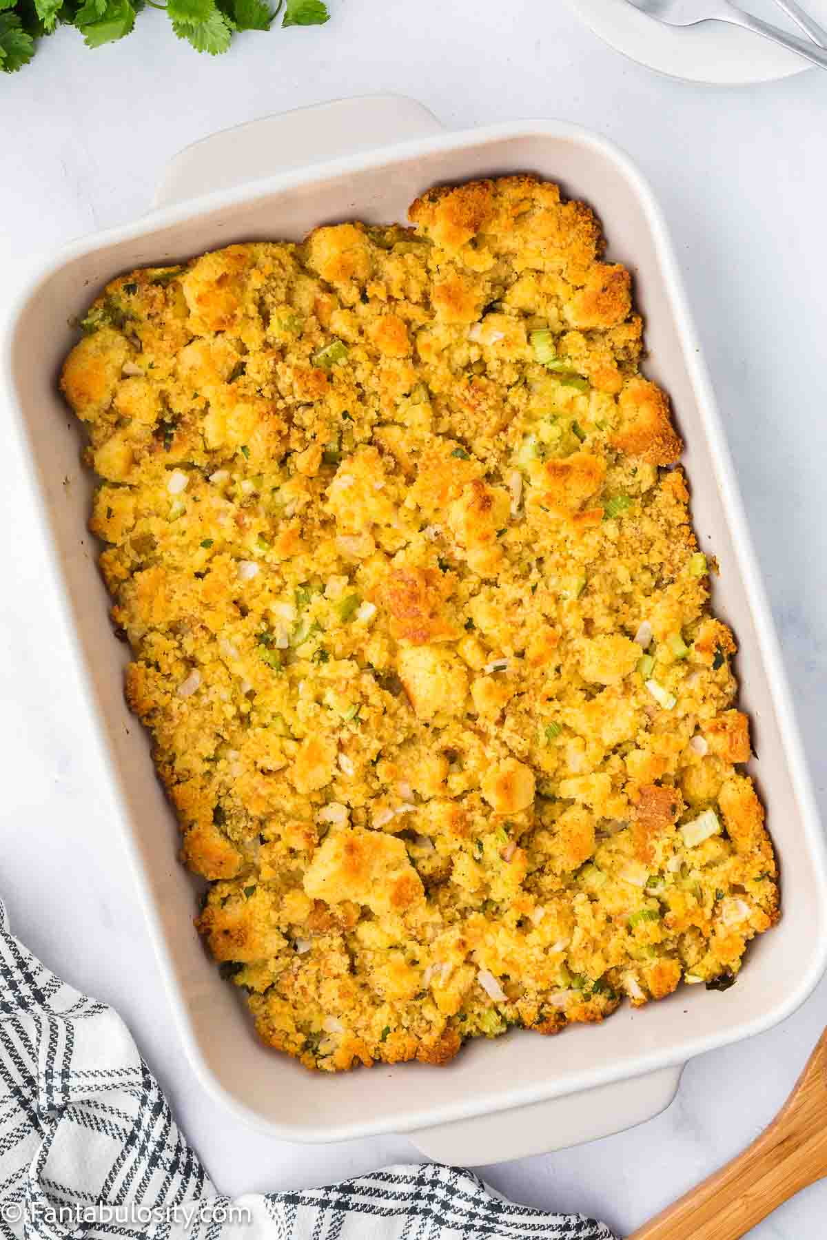 Baked cornbread dressing in 9x13 baking dish.
