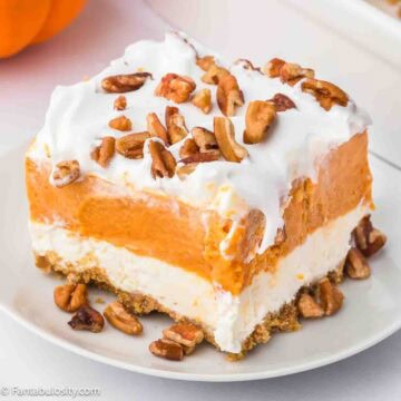 A slice of pumpkin lush on round plate.