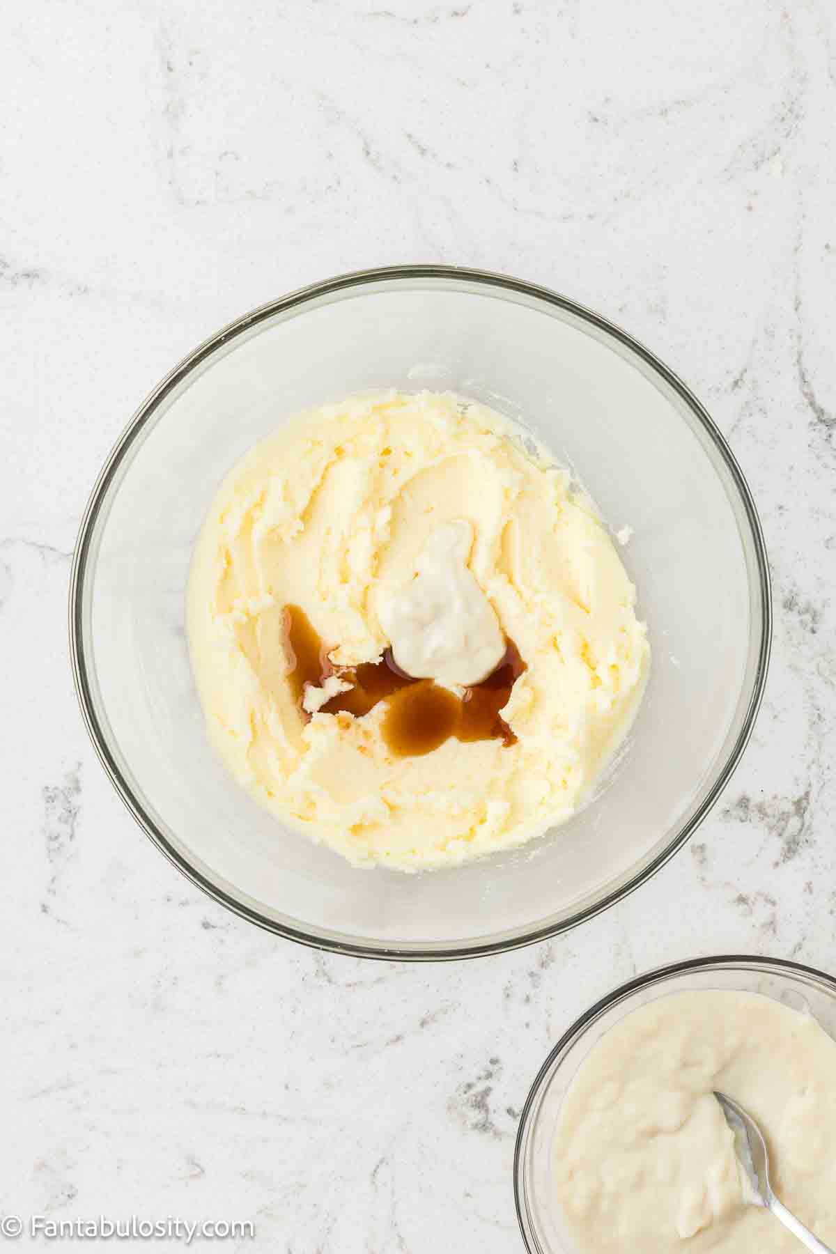 Vanilla, butter and sugar in mixing bowl for ermine frosting.