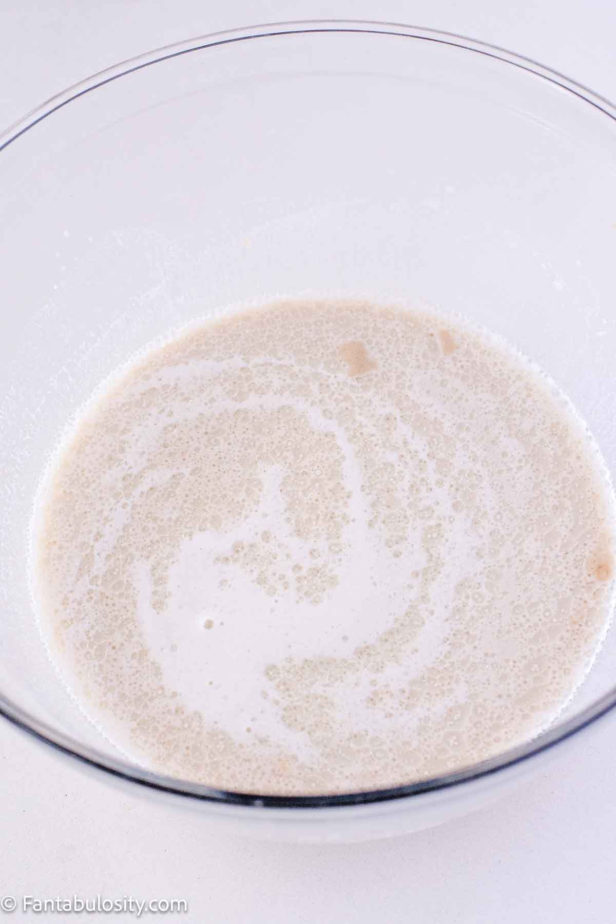 Milk and sugar mixture mixed with yeast mixture.