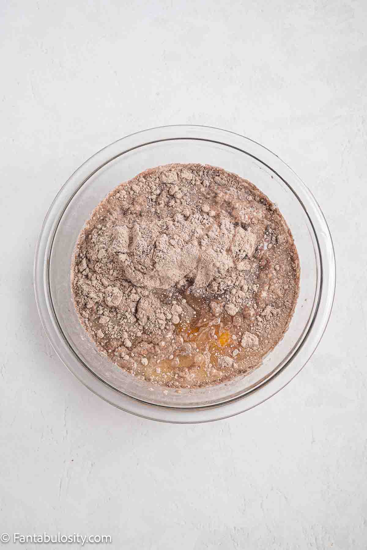 Cake mix, oil and egg in mixing bowl.