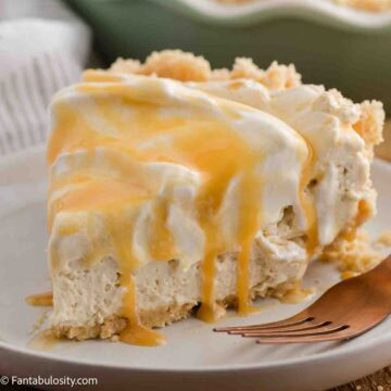 A slice of caramel cream pie on a round plate, with a fork lying next to it.