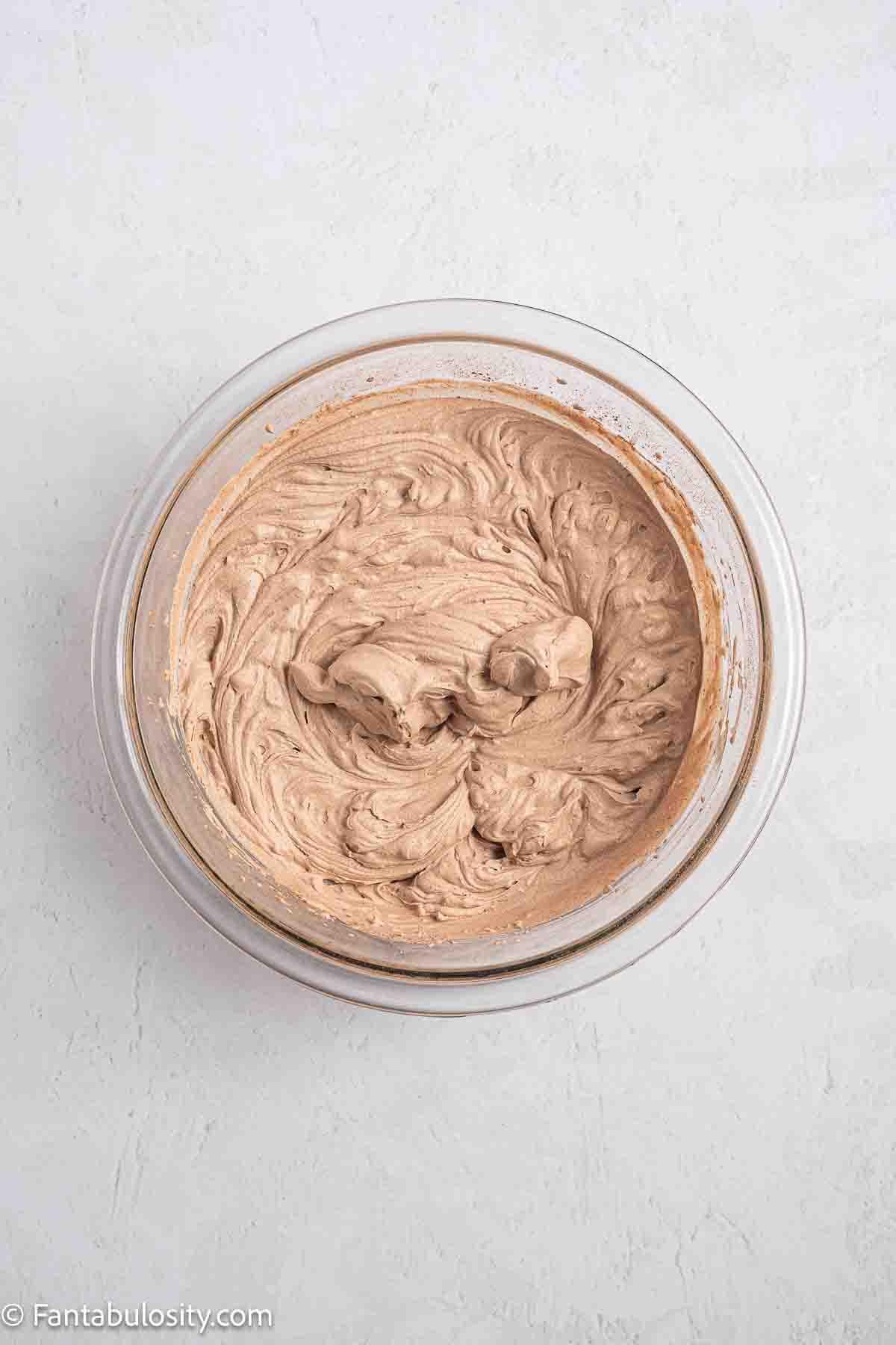 Chocolate Whipped Cream Frosting in mixing bowl.