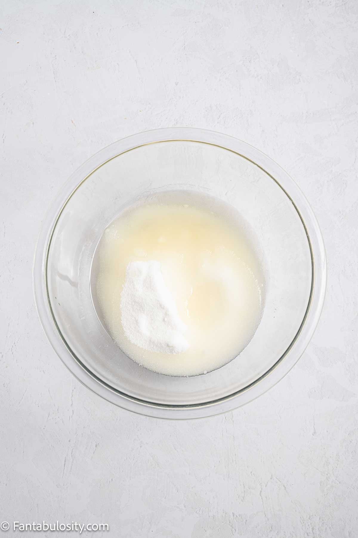 Oil and sugar in mixing bowl.