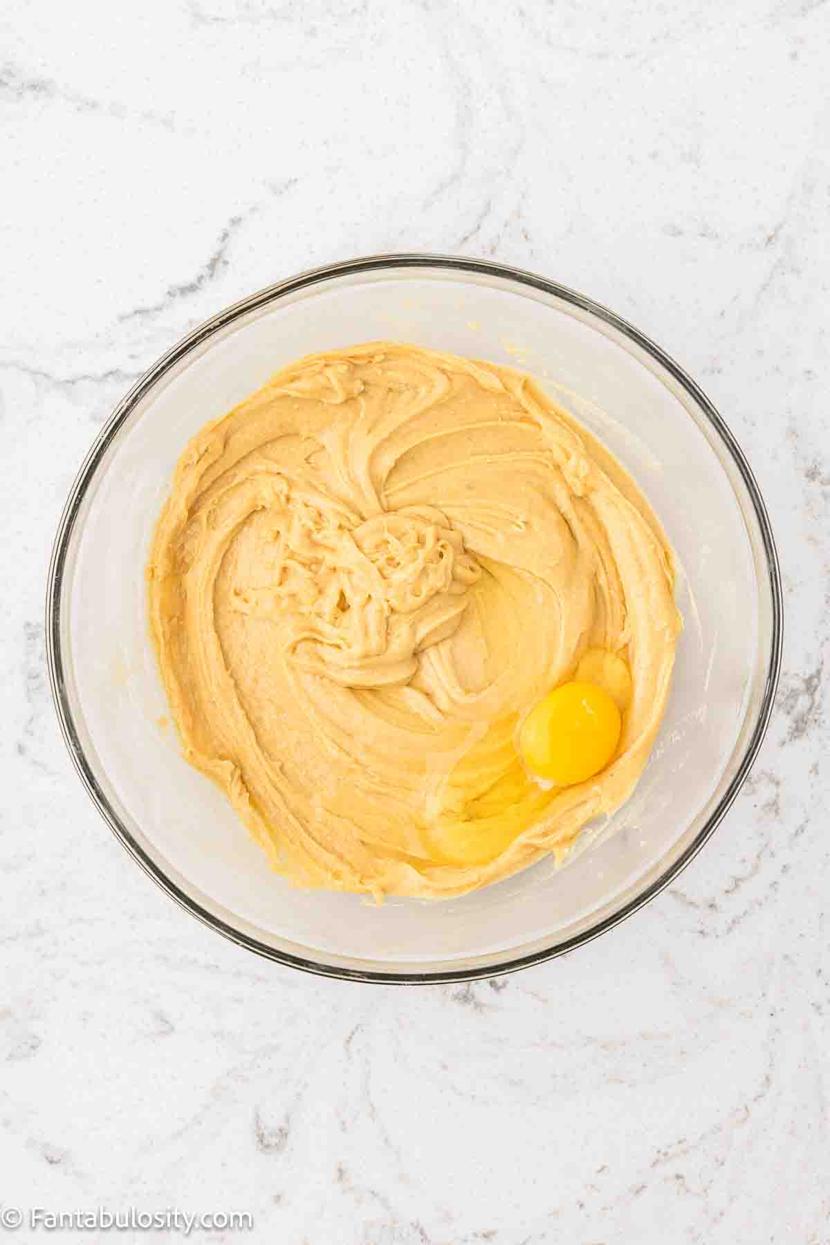 Oil, water, wine and eggs added to mix in mixing bowl.