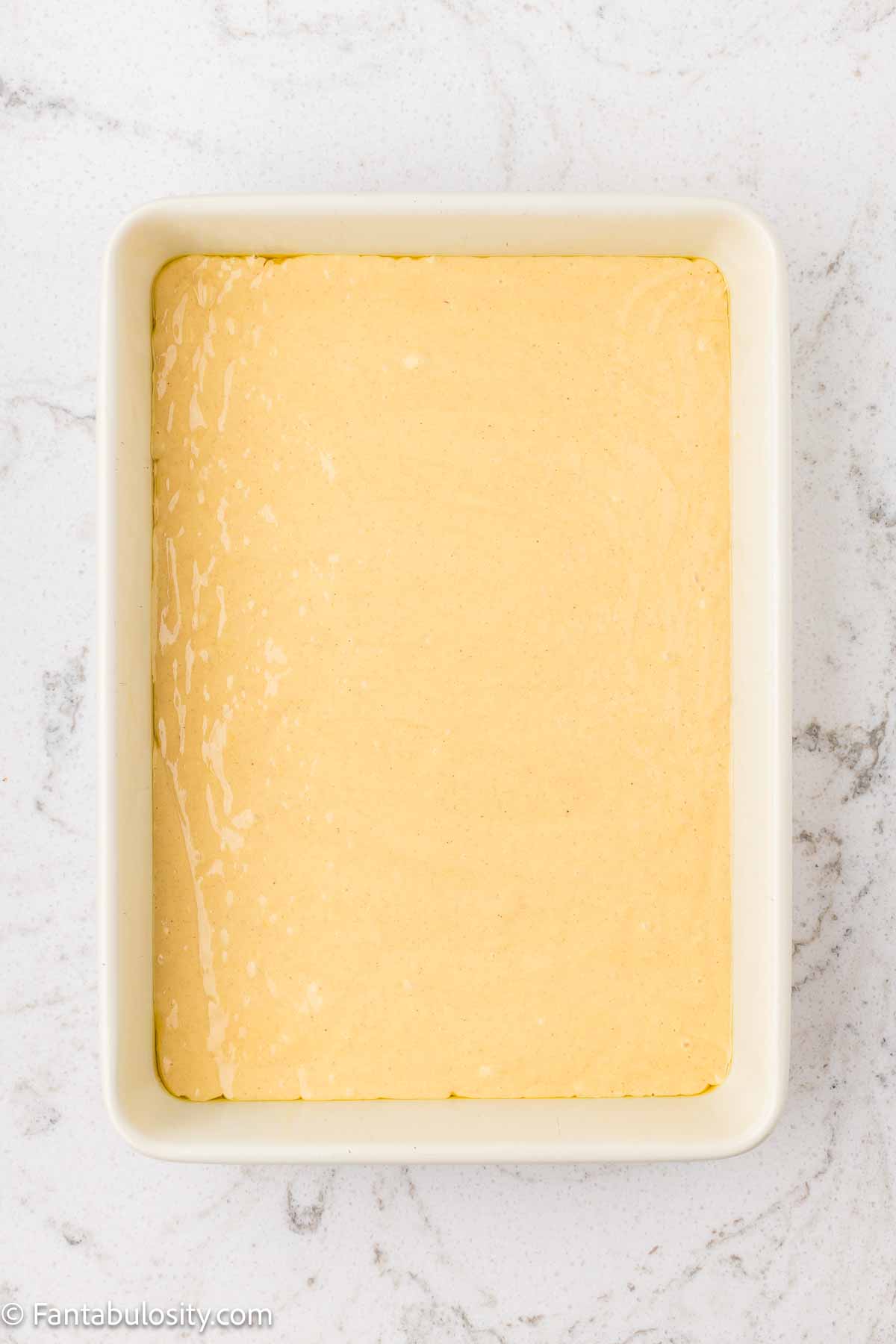 Cake batter poured in to 9x13 baking dish.