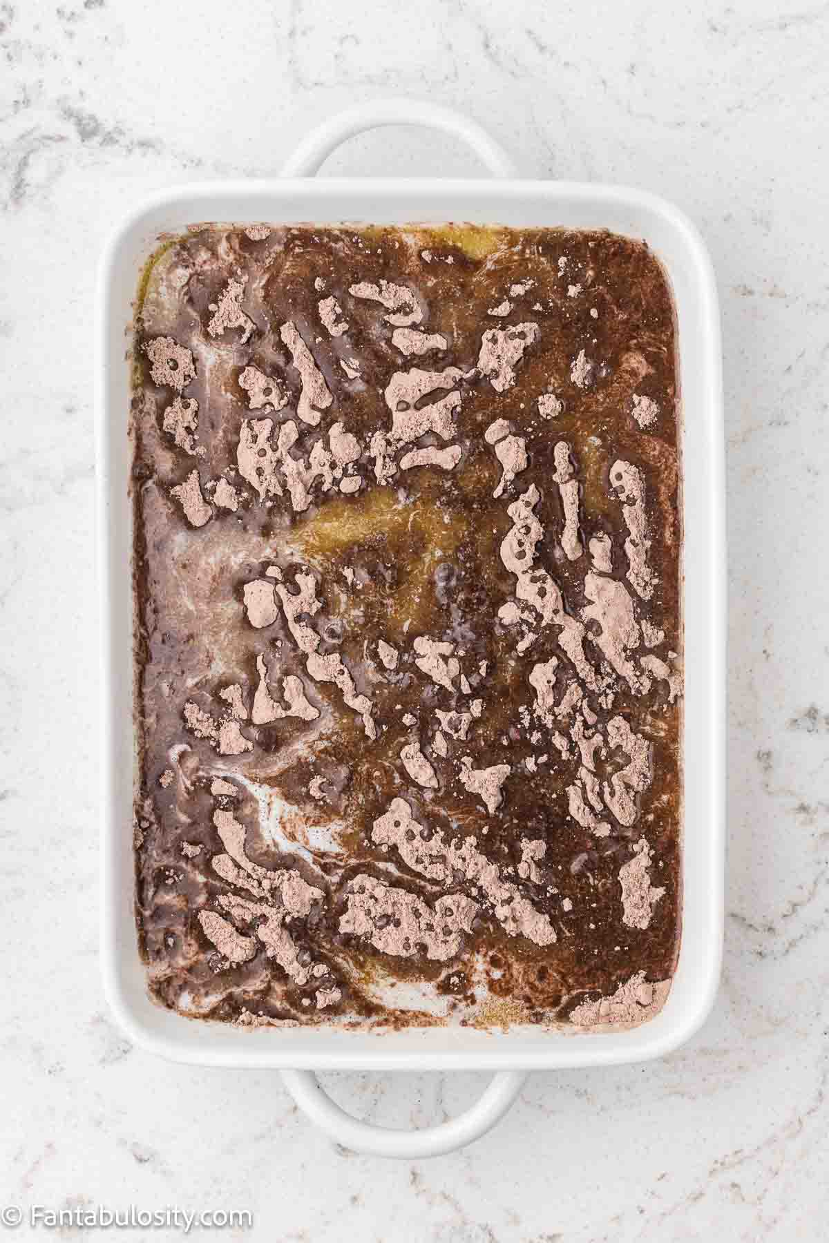 Melted butter poured over the top of the chocolate cake mix in dump cake.