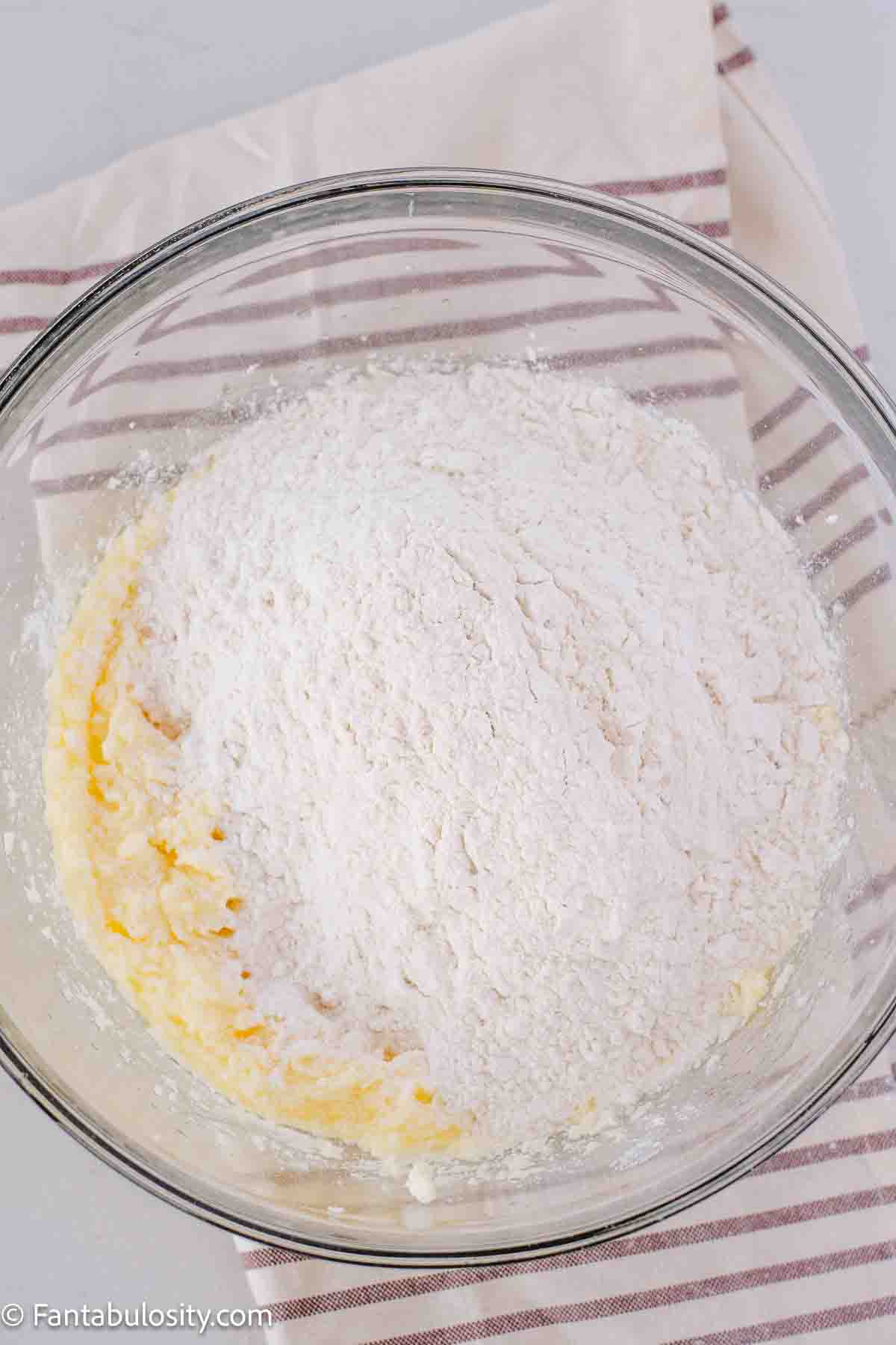 Dry ingredients mixed in with wet in mixing bowl.