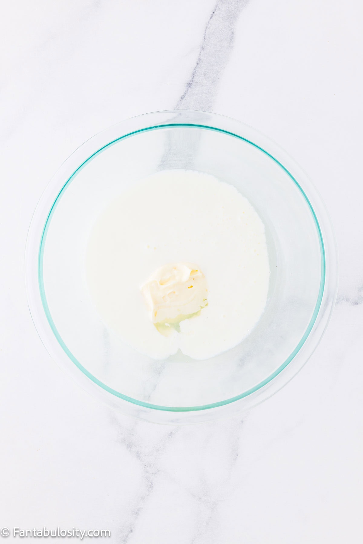 Buttermilk, mayonnaise and dill pickle juice in mixing bowl.