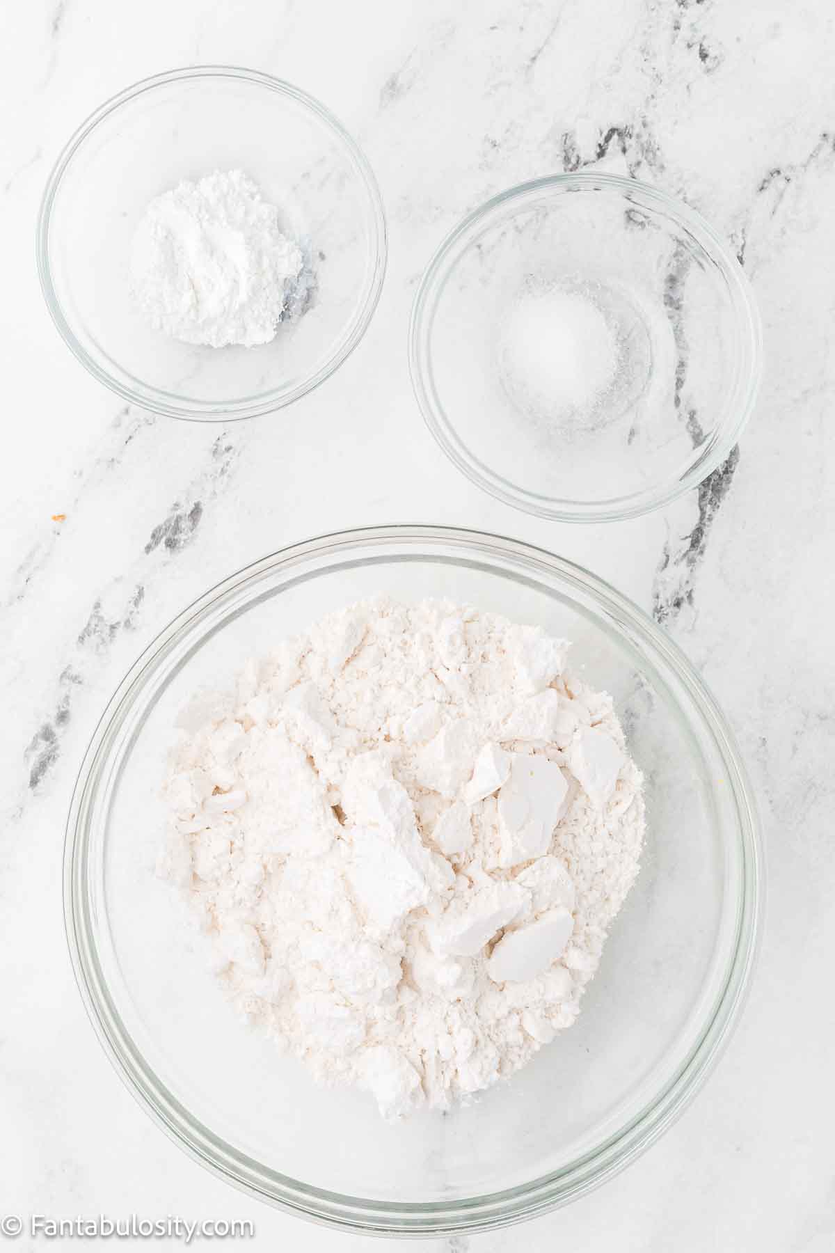 Cake flour, baking powder and salt in mixing bowls.