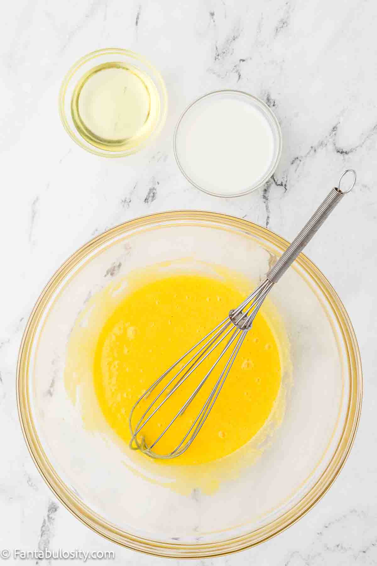 Whisked eggs and sugar in mixing bowl.