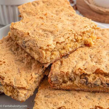 Stack of sad cake pieces on a plate.