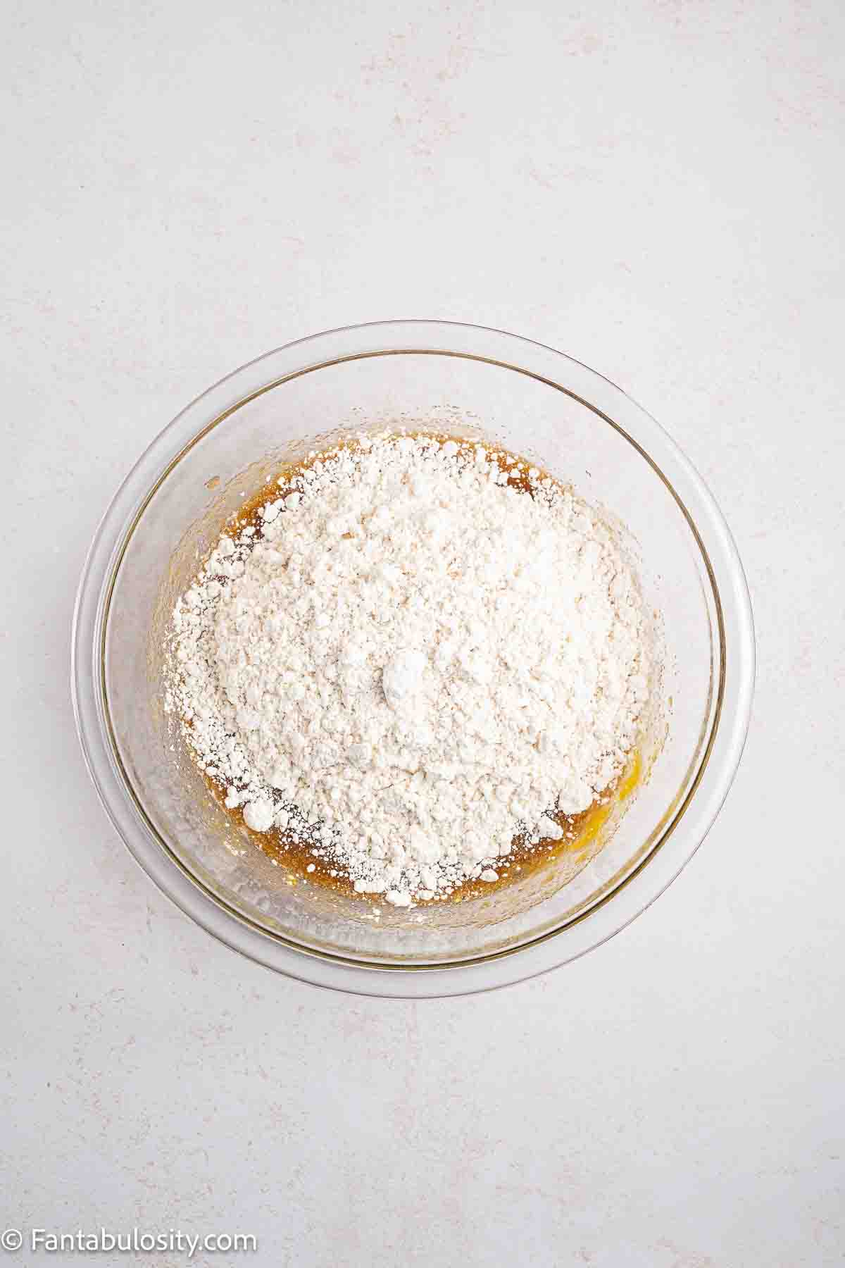 Bisquick added to egg mixture in mixing bowl.