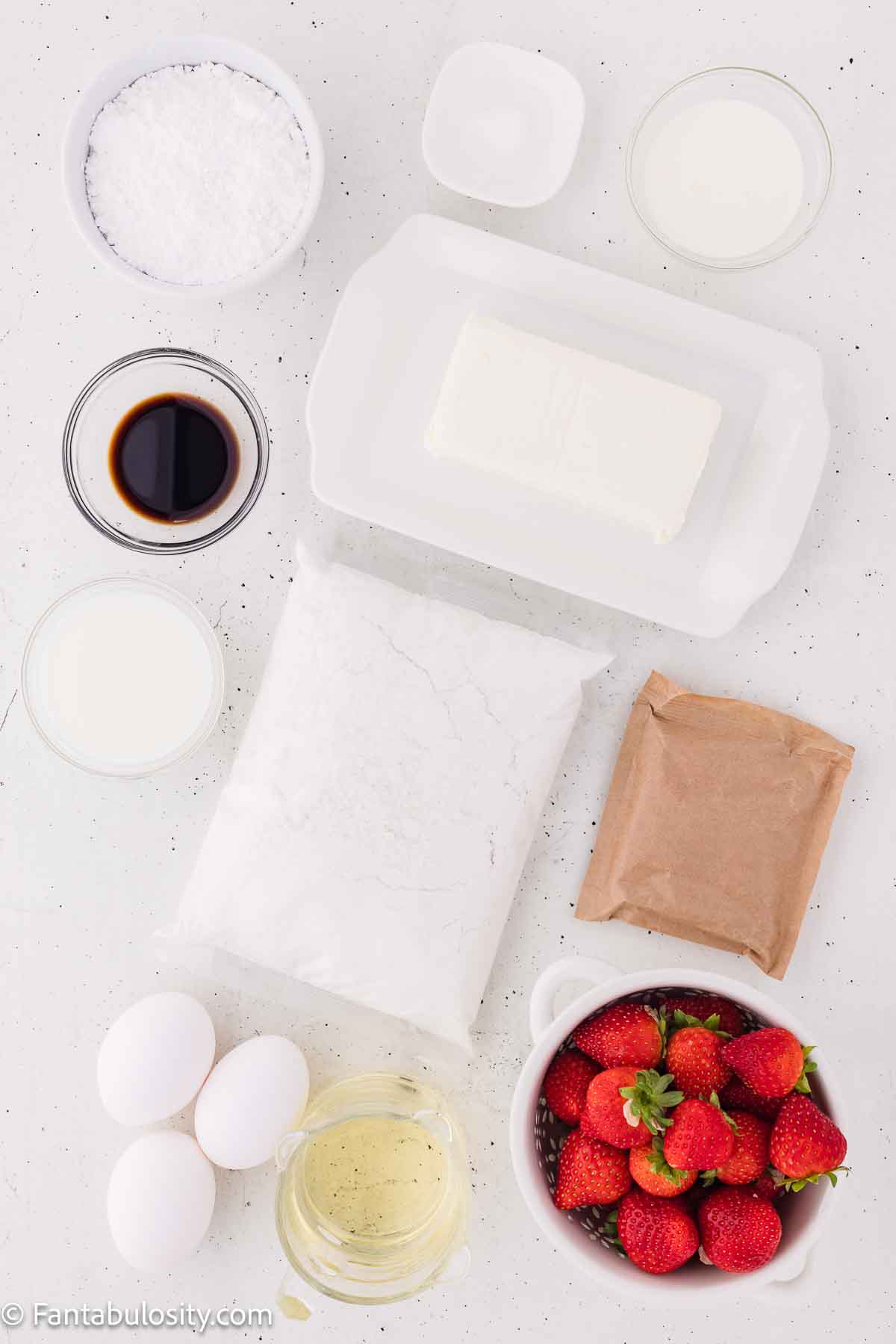 Ingredients for strawberry jello cake, sitting on kitchen counter.