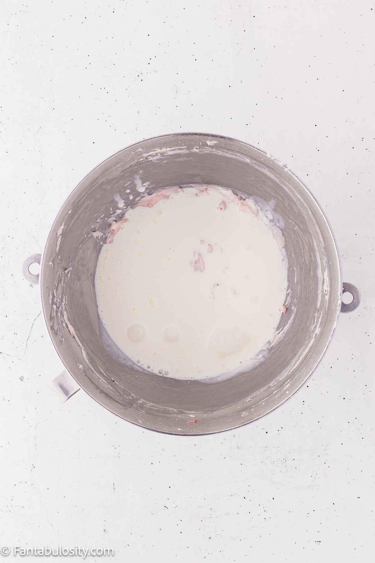 Heavy cream and vanilla added to strawberries and cream cheese mixture.