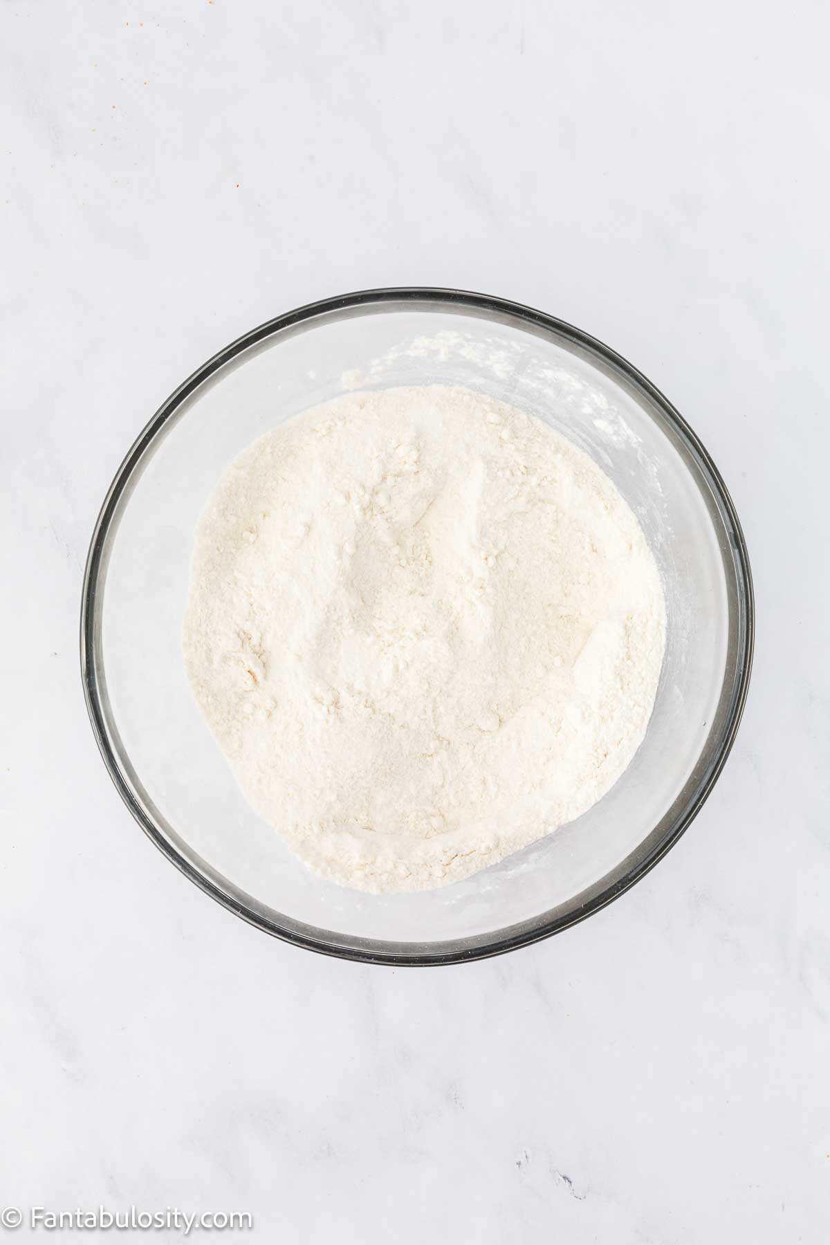 Dry ingredients mixed together in a mixing bowl.