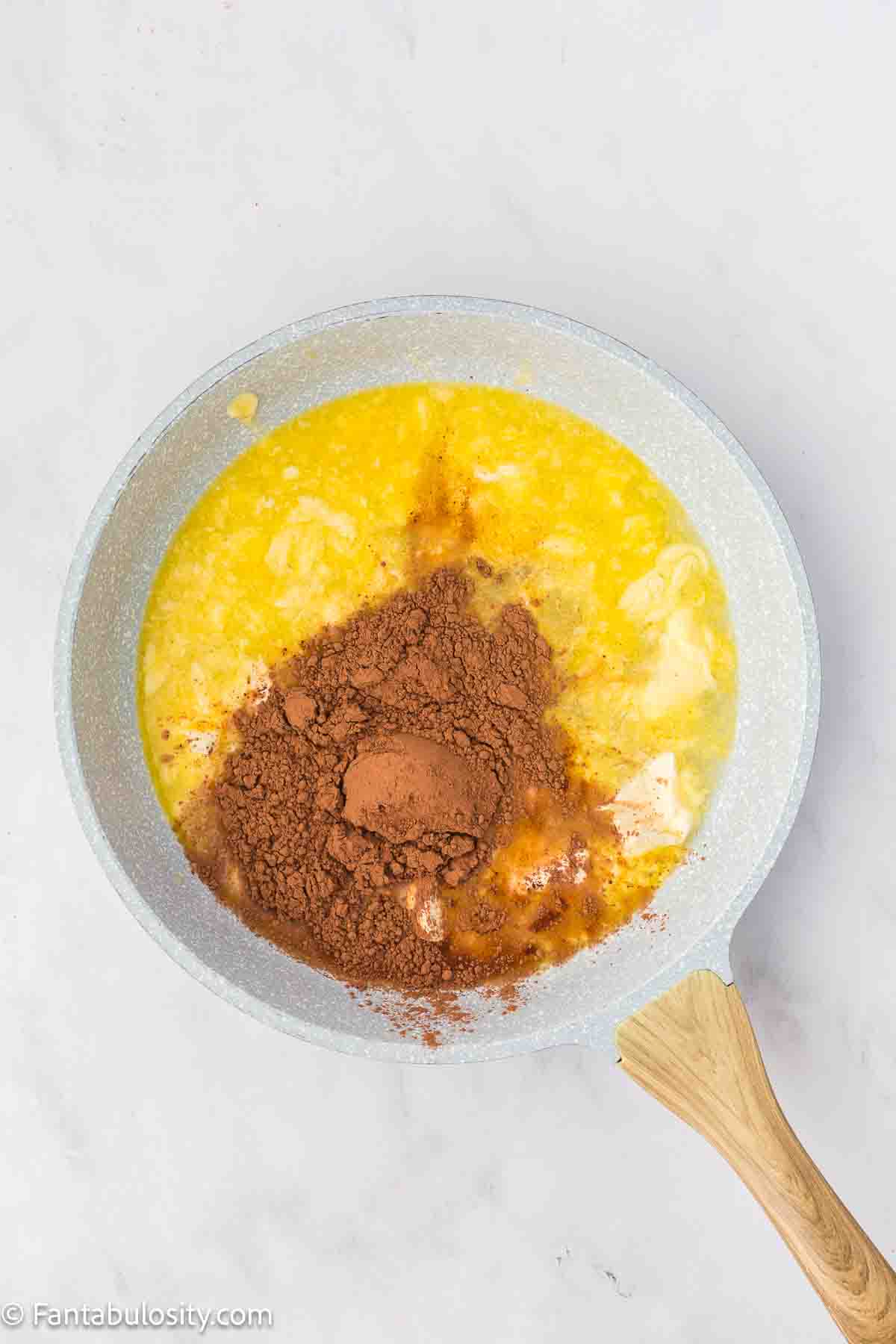 Melted butter, water and cocoa in sauce pan. 