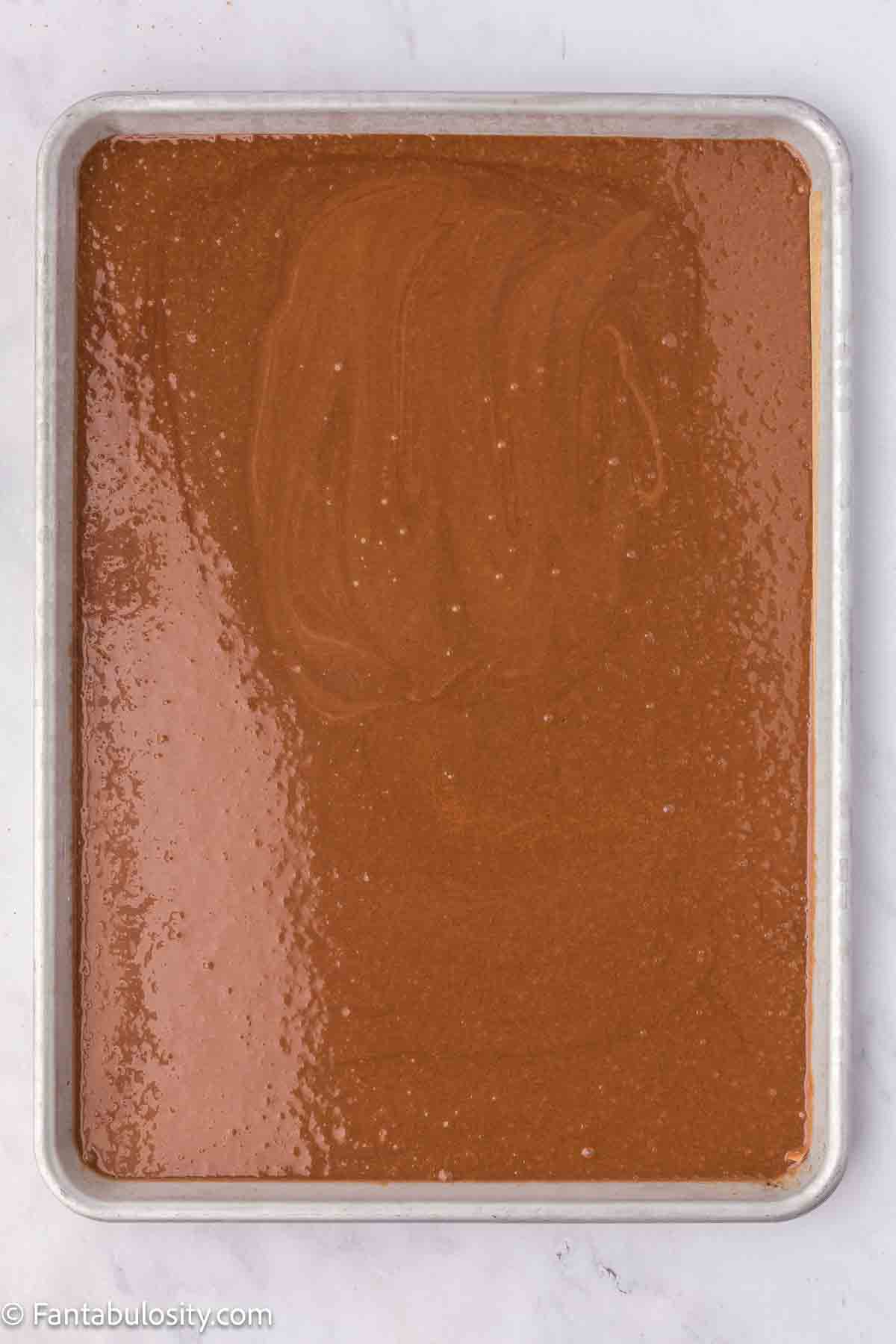 Hot cocoa mixture poured over the top of the cake.