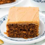 A slice of burnt sugar cake on a round, vintage plate.