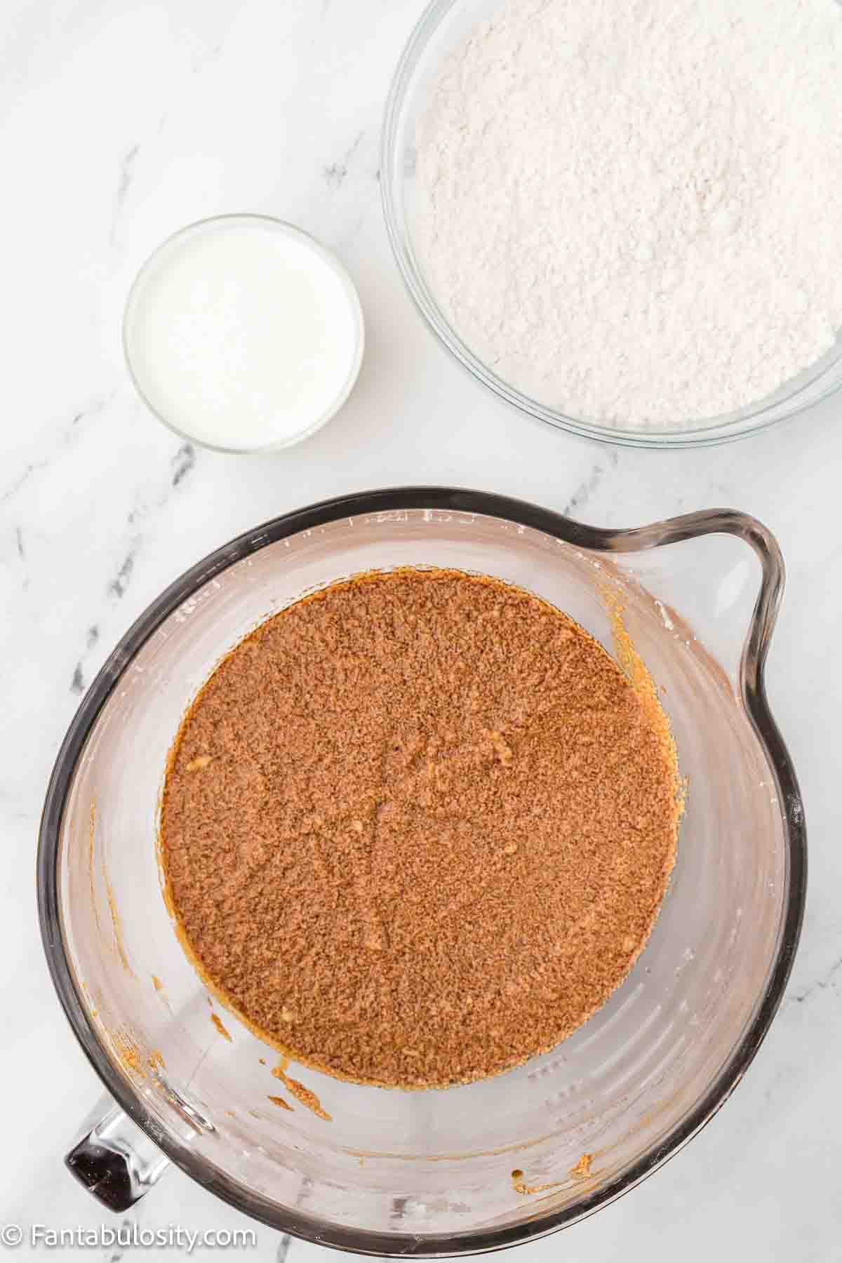 Burnt sugar and vanilla added to sugar and butter mixture.