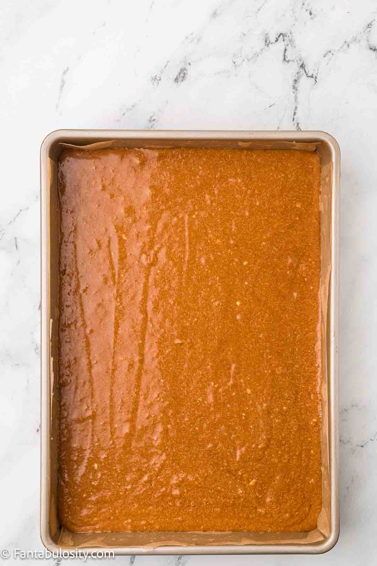 Burnt sugar cake batter poured in to 9x13 baking dish.