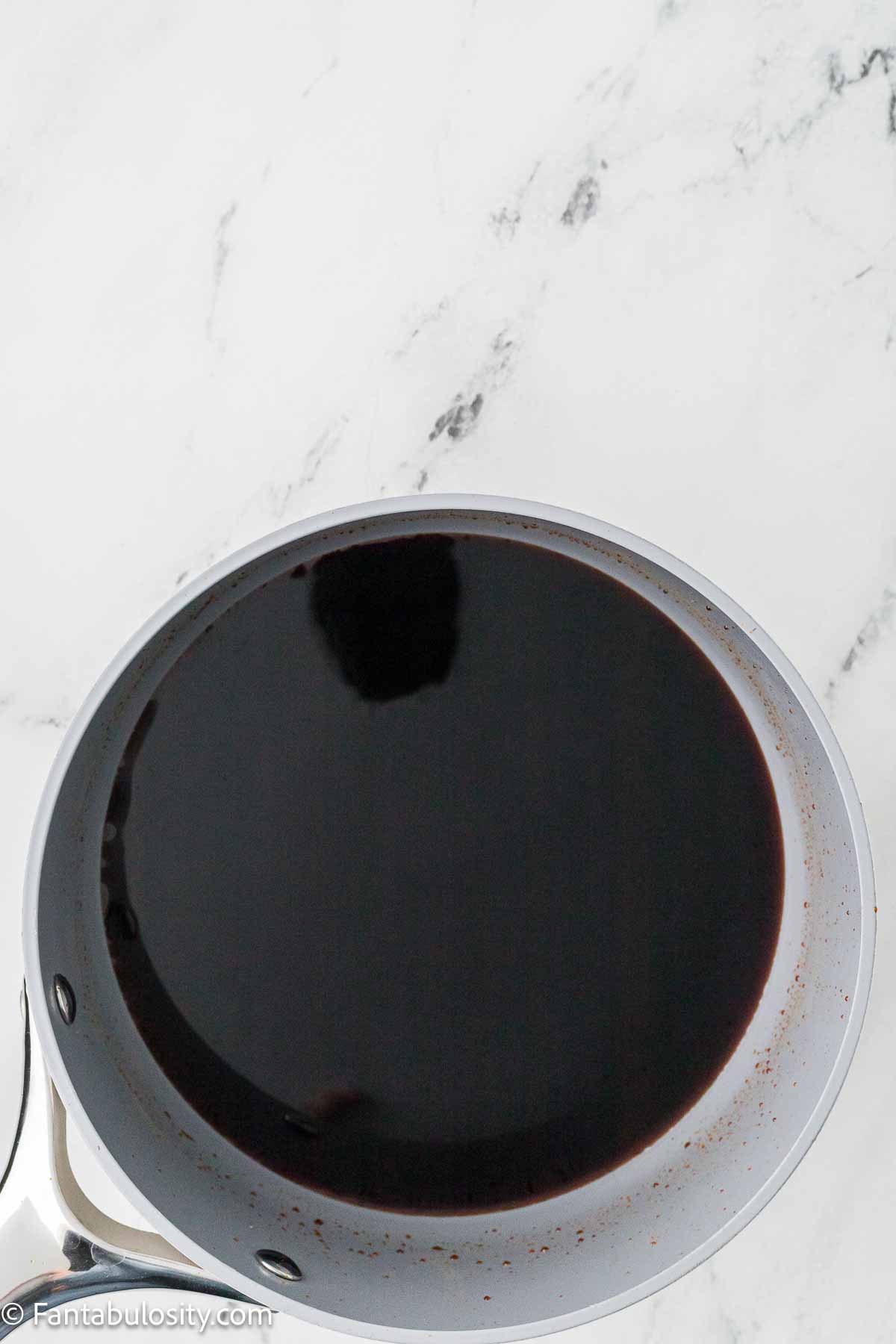 Burnt sugar in saucepan. 