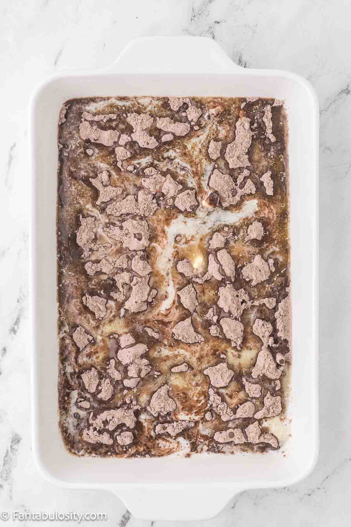 Melted butter poured over the top of the chocolate cake mix.