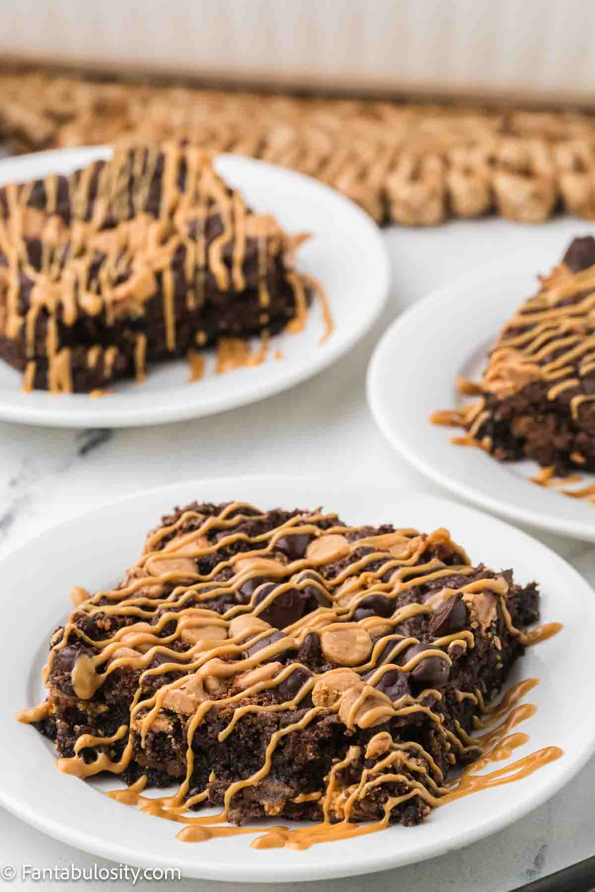 A slice of chocolate peanut butter dump cake on a plate.