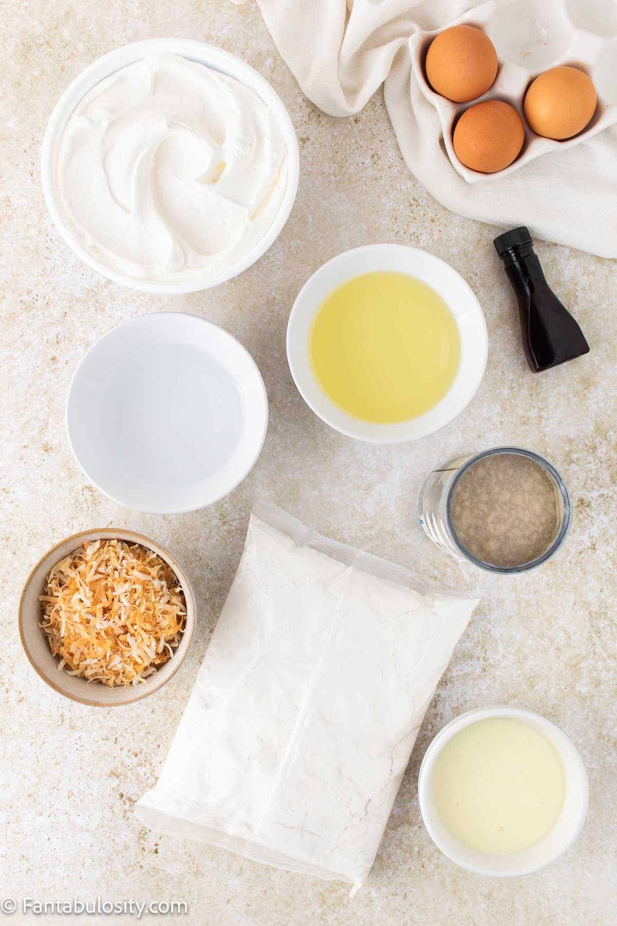Ingredients to make coconut poke cake on counter.