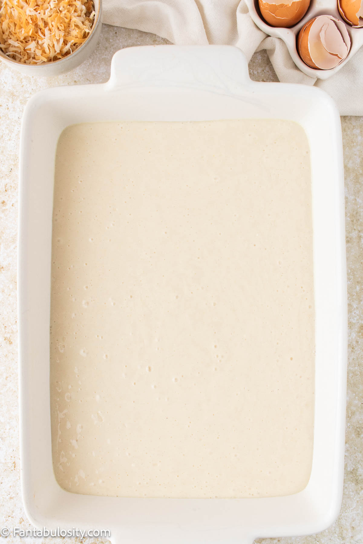 White cake batter in 9x13 baking dish.