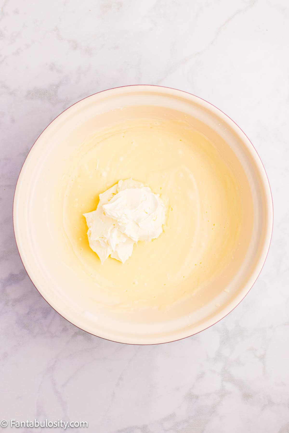 Pudding and cream cheese together in mixing bowl.